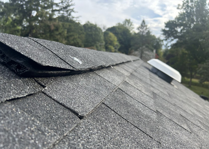 Storm damaged asphalt shingle roof repair in Englewood New Jersey